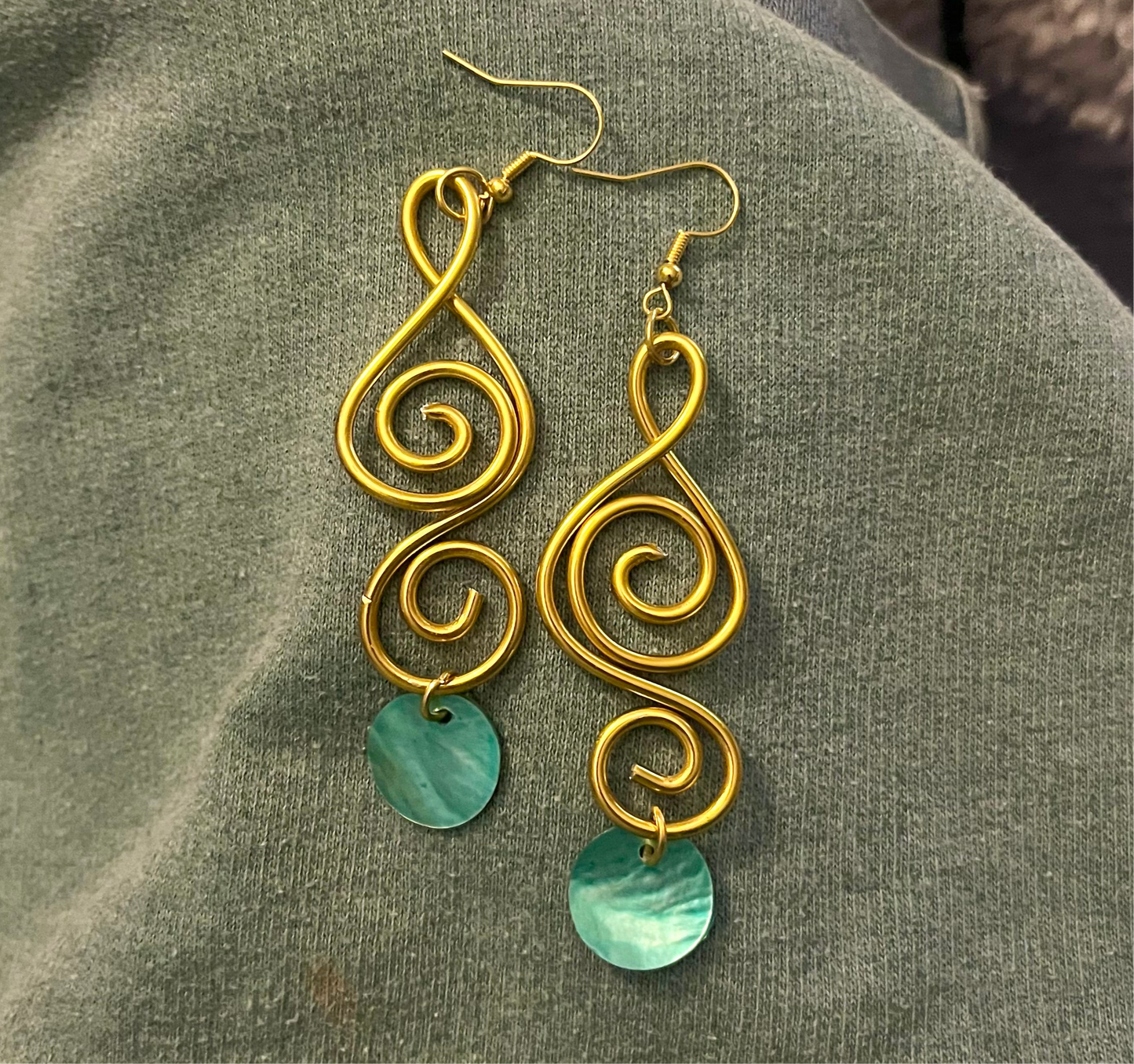 aqua sister pair of gold swirls